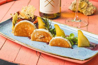 Grilled goat cheese with rosemary pear and orange plum tartlet
